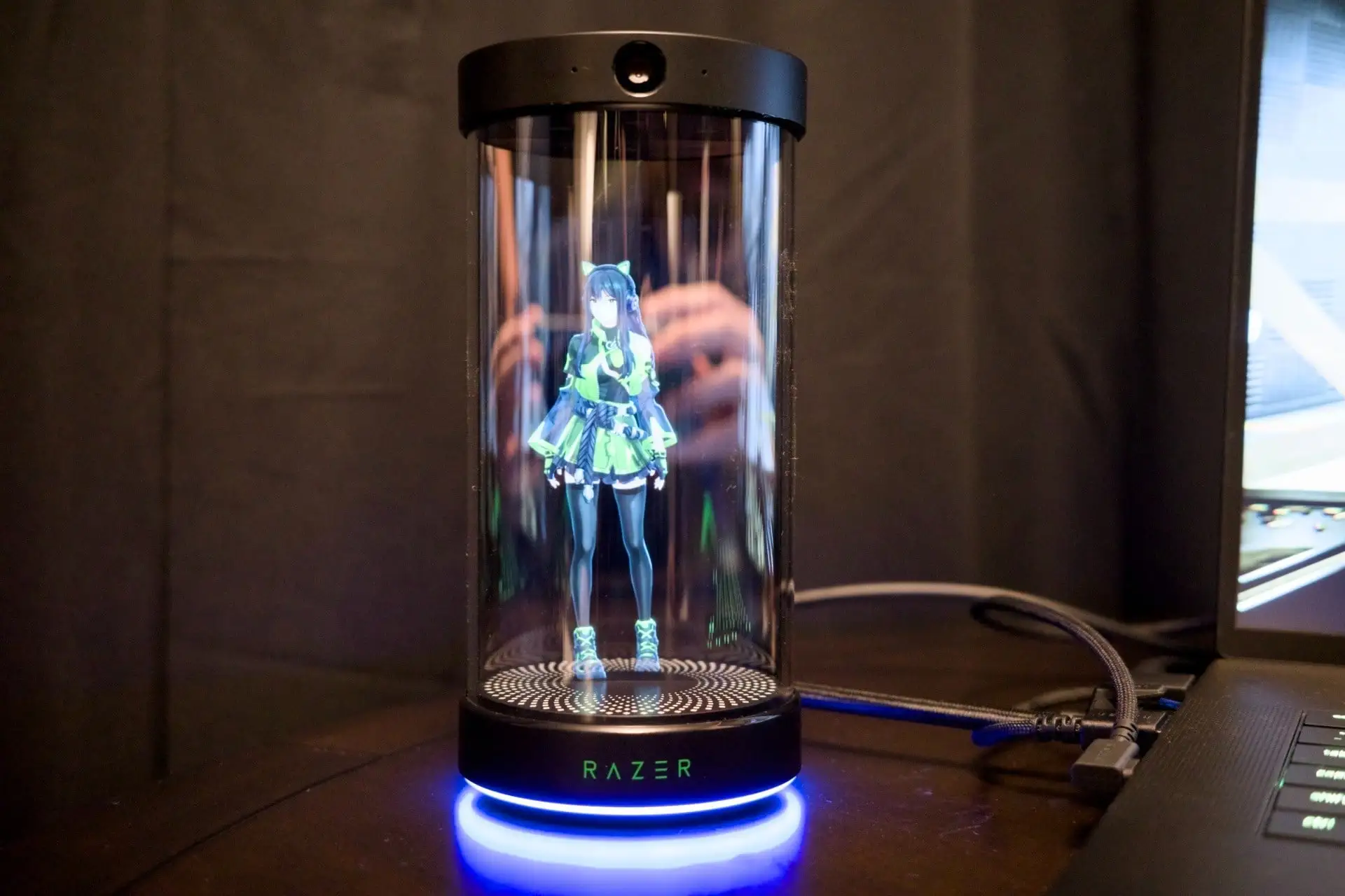 Holographic or volumetric display "can" showing a waifu inside