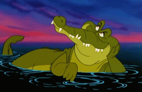 crocodile gif from the animated peter pan movie where he's lounging looking up
