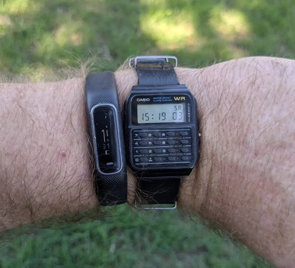 Photo of Casio calculator watch and Garmin Vivismart being worn on the same wrist