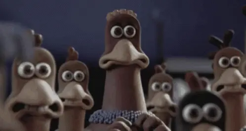 Scene from the movie "Chicken Run" where a crowd of chickens all panic.